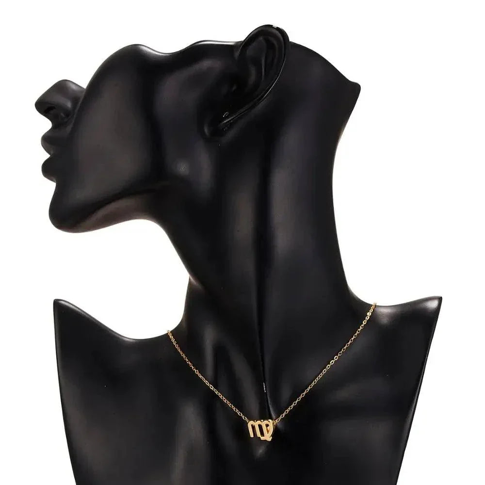 Gold  Zodiac Sign Pendant Necklace on mannequin bust, elegant and celestial charm, free offer.