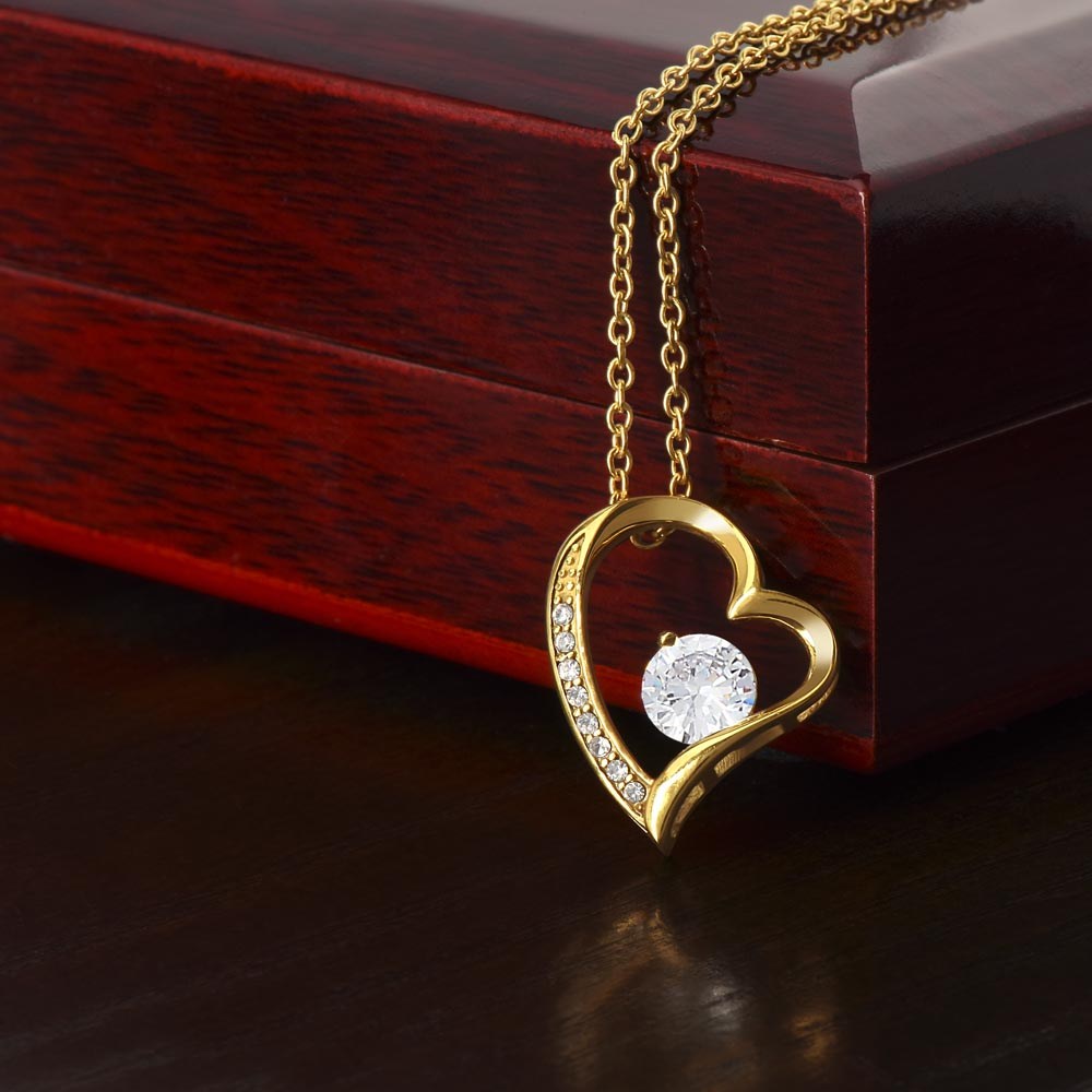 Heart-shaped necklace with cubic zirconia on mahogany box, wife gift.