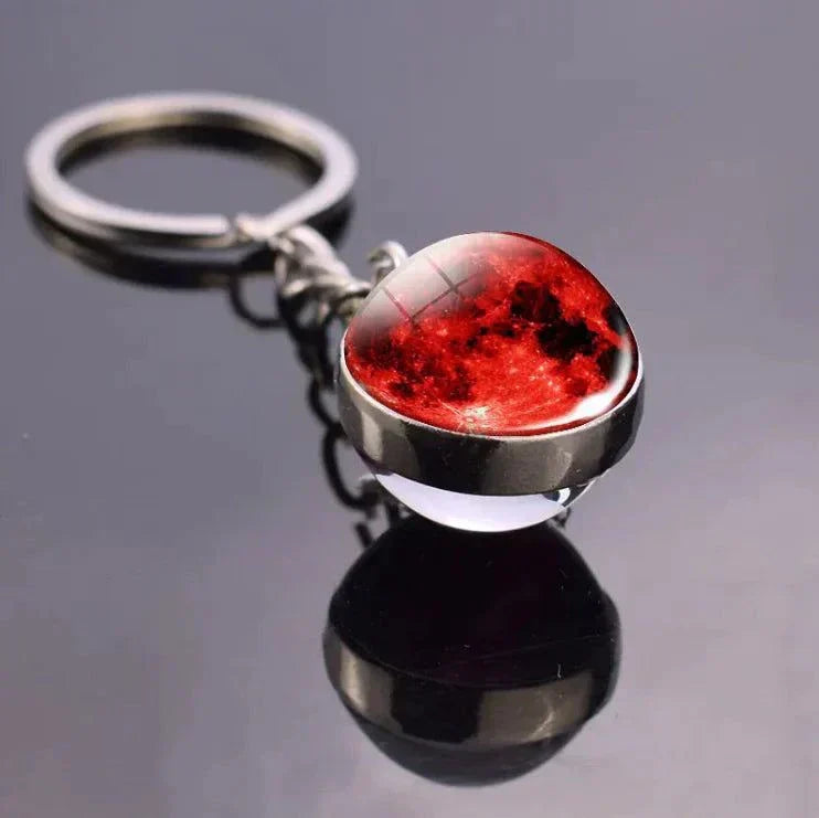 The Planets in The Solar System & Planets Key Ring with red planet design on reflective surface.