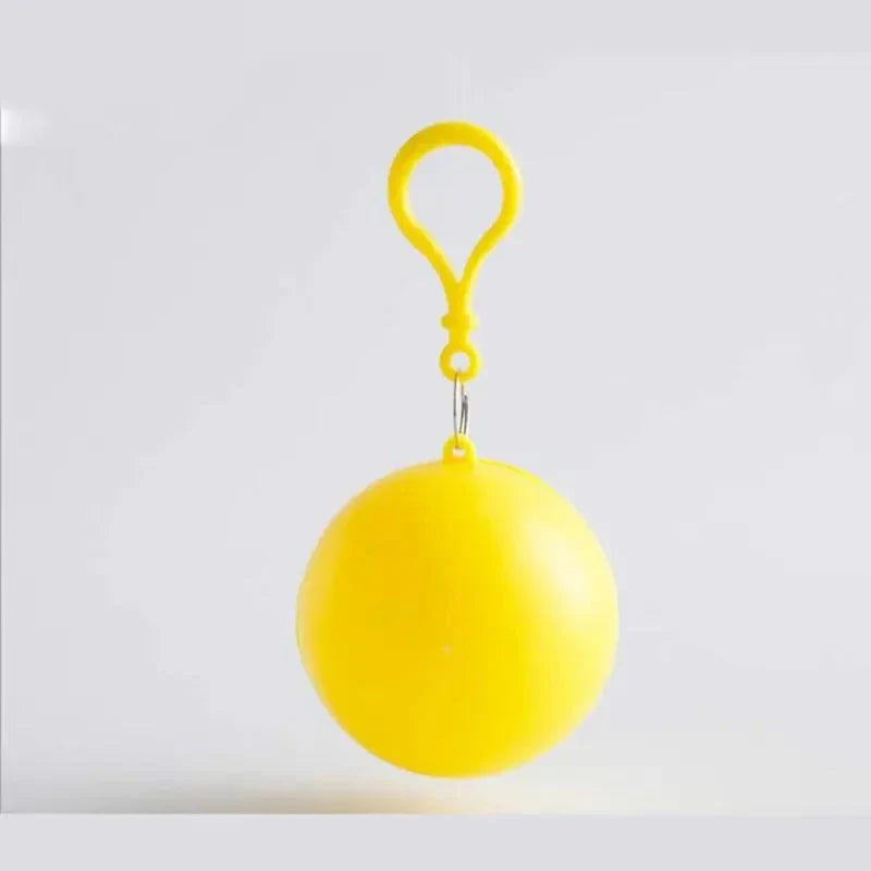 Compact disposable rain poncho with key ring attachment in yellow case for easy travel and rain protection.